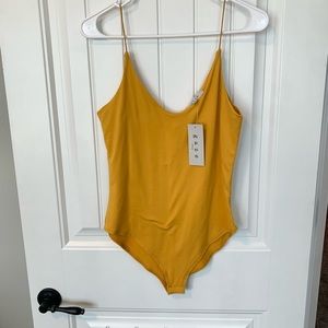 NWT mustard bodysuit medium
